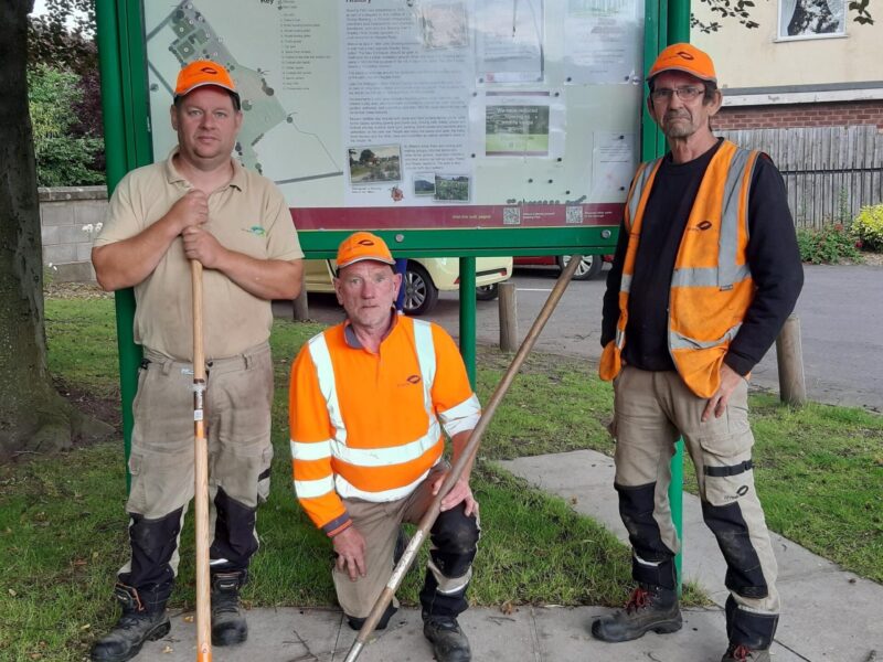 bowing park staff in front of sign