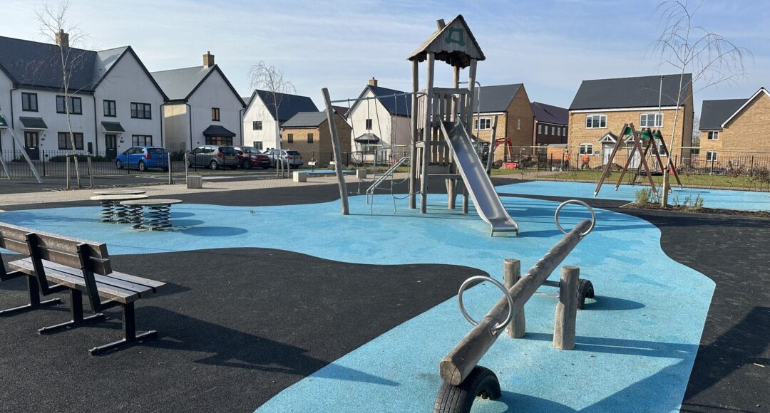 Play area for Vistry Homes, Sawtry, featuring wetpour, manufactured from sourced material from the UK and Western Europe only, comprising of layers made from end-of-life truck tires. Sensory movement values such as swinging, bouncing, sliding and rocking are incorporated into the design.
