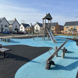 Play area for Vistry Homes, Sawtry, featuring wetpour, manufactured from sourced material from the UK and Western Europe only, comprising of layers made from end-of-life truck tires. Sensory movement values such as swinging, bouncing, sliding and rocking are incorporated into the design.
